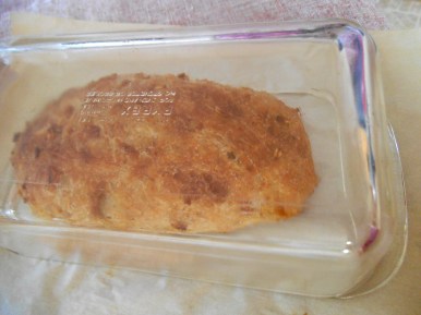 Half-size loaf covered with a glass baking pan