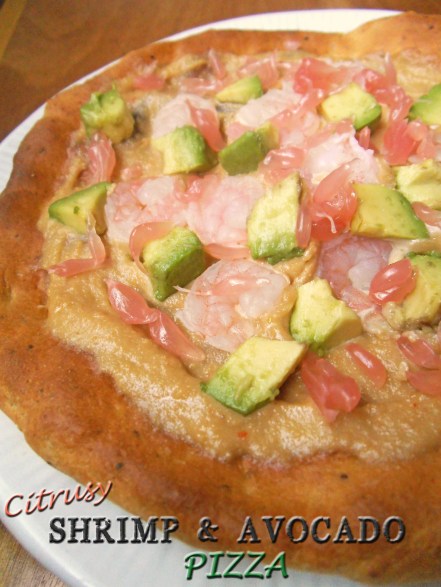 A Dairy-Free Pizza topped with Pink Pomelo, Shrimp and Avocado