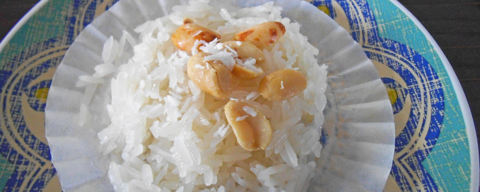 Sticky Rice Steamed in a Cupcake Liner - topped with peanuts