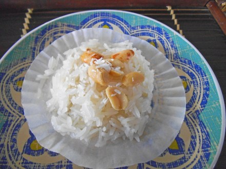 Sticky Rice Steamed in a Cupcake Liner - topped with peanuts